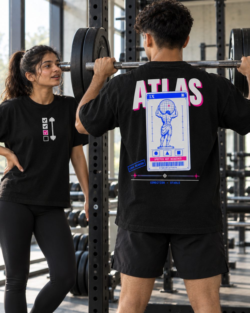 Atlas tee, full back print, at the squat rack with a training partner