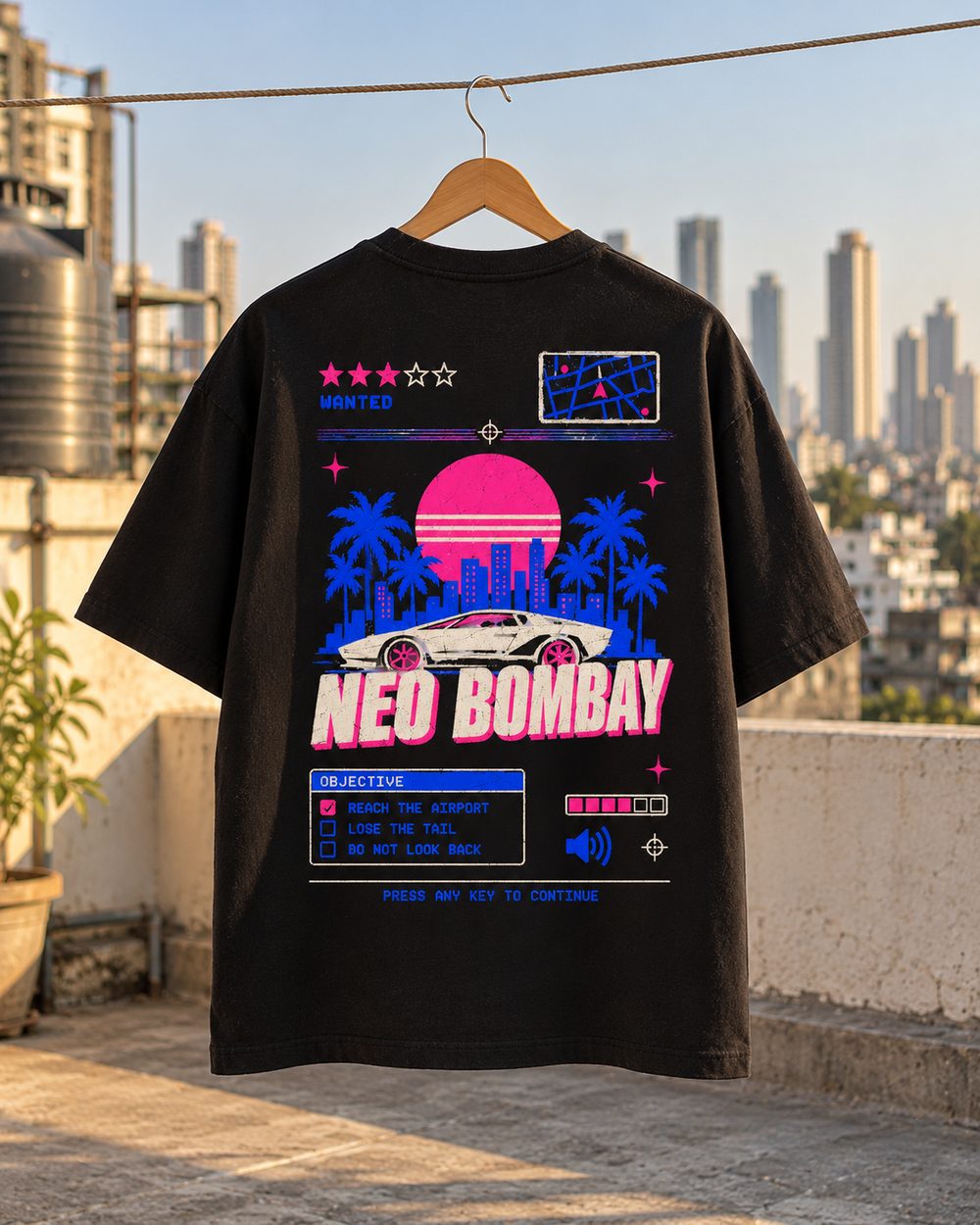 Neo Bombay tee on a hanger on a rooftop, back print, city towers behind