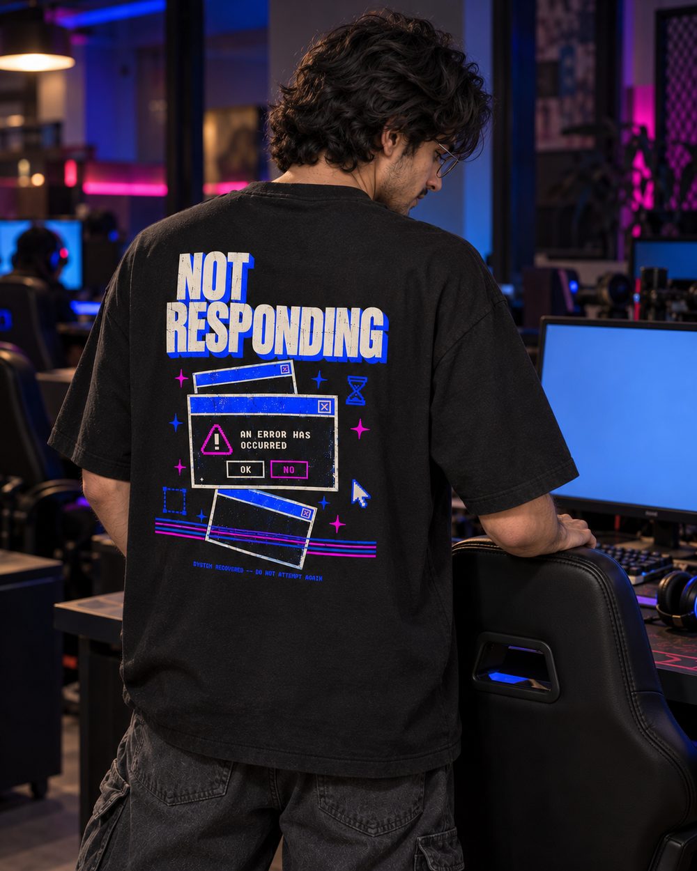 Not Responding tee, full back print, standing at a gaming desk