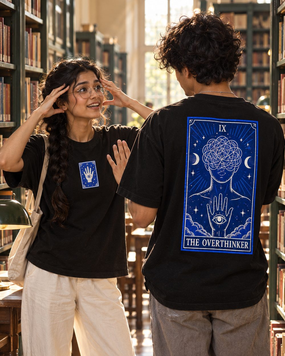 Two people in The Overthinker tees in a library, chest print and back print